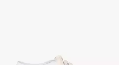 The Resurgence of White Canvas Sneakers: A Summer Styling Guide